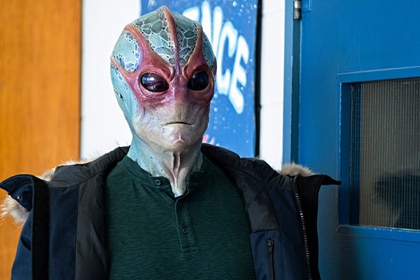 Alien Harry (Alan Tudyk) stands in Resident Alien Episode 305.