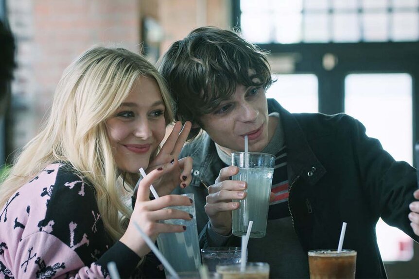 (l-r) Lexy Cross (Alyvia Alyn Lind) and Grant Collins (Jackson Kelly) sip on drinks and smile for a selfie in Chucky 302 -- “Let the Right One In”