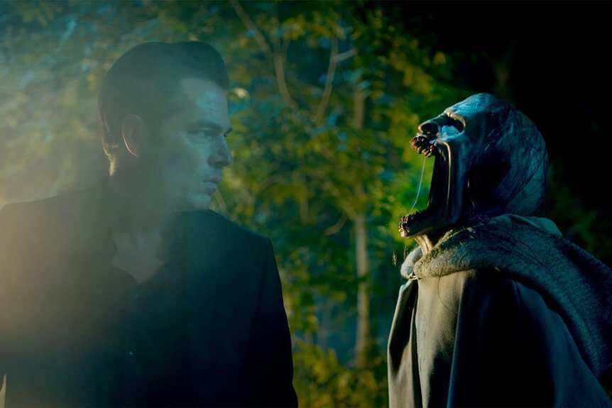 Luke Roman (Tim Rozon) looks at a wide mouthed ghoul in SurrealEstate 202