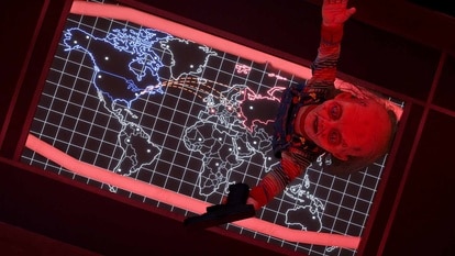 Chucky stands on top of a world map in Chucky Episode 306.