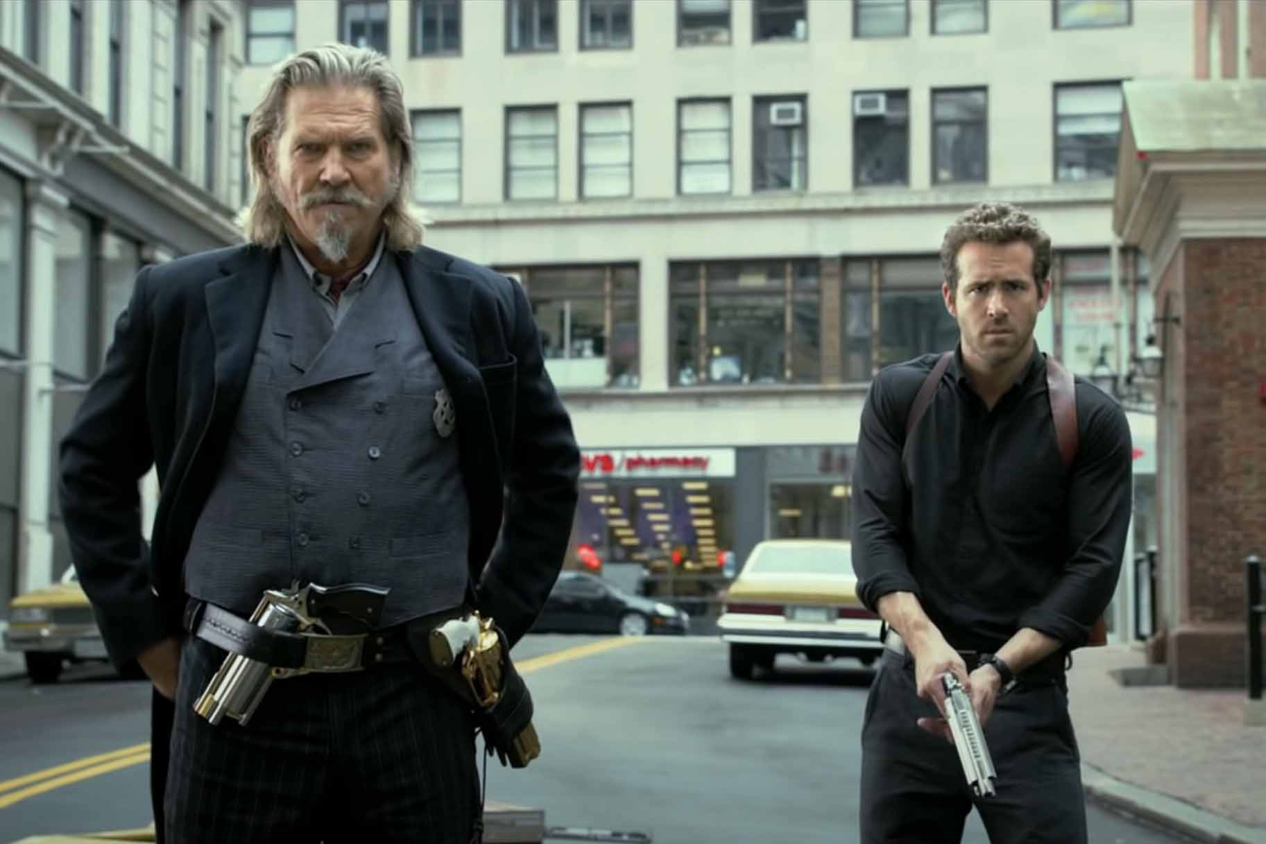 Roicephus (Jeff Bridges) and Nick Walker (Ryan Reynolds) don weapons in R.I.P.D. (2013).